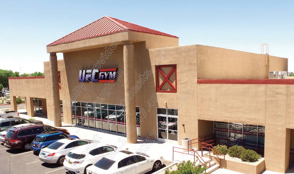 UFC Gym Front View with Cars Parked Outside